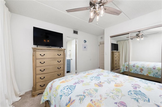 3000 Gulf Blvd Unit 701, South Padre Island, TX 78597 - bedroom with light colored carpet, a closet, and ceiling fan