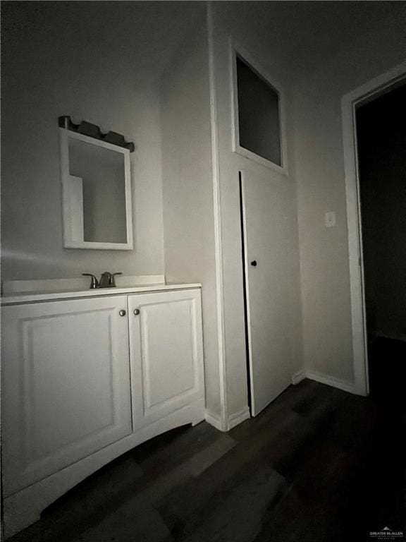 bathroom featuring hardwood / wood-style floors and vanity