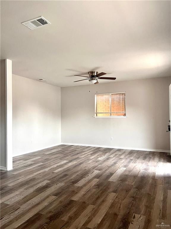 unfurnished room featuring ceiling fan and dark hardwood / wood-style floors