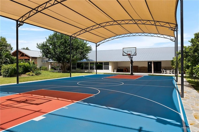 view of sport court featuring a yard