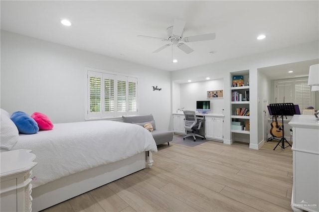 bedroom with ceiling fan and light wood-type flooring