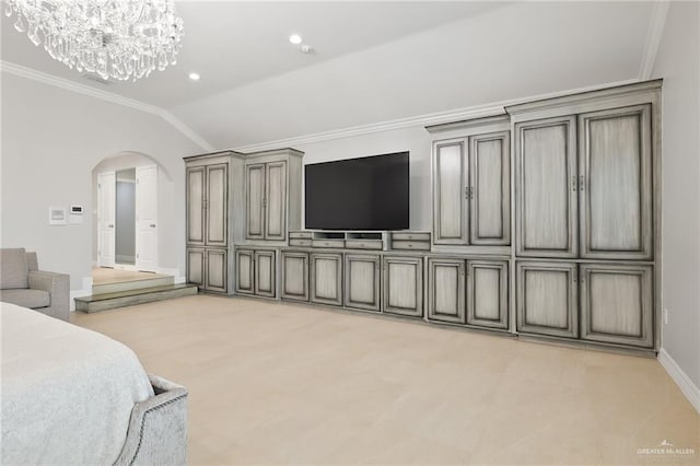 carpeted bedroom with an inviting chandelier, vaulted ceiling, and ornamental molding