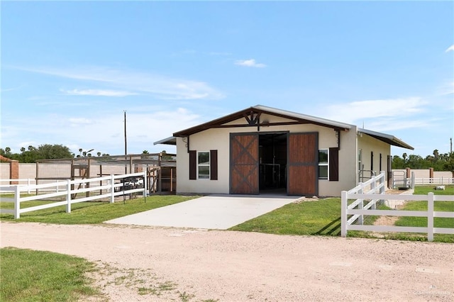 view of front of home with an outdoor structure