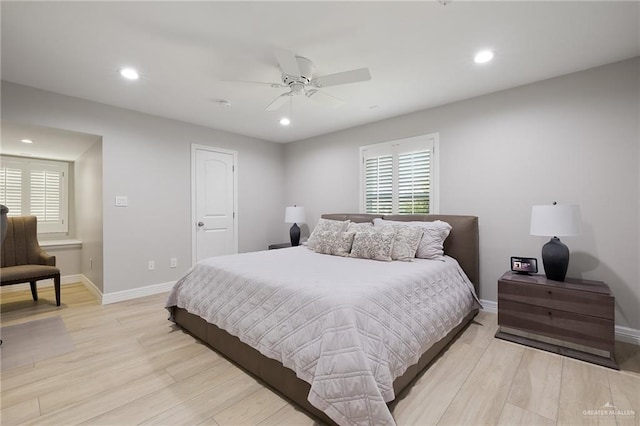 bedroom with ceiling fan and light hardwood / wood-style flooring