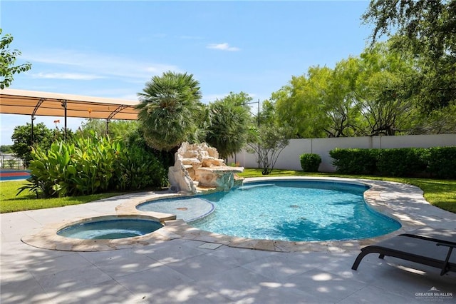 view of pool with an in ground hot tub