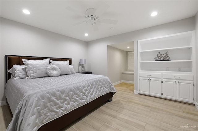 bedroom featuring ceiling fan and light hardwood / wood-style flooring