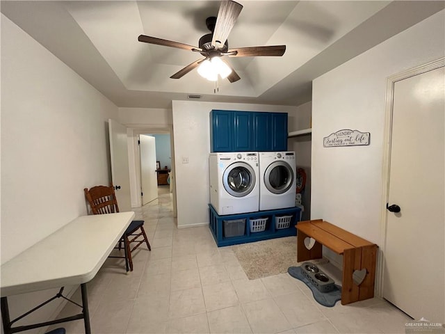 washroom with cabinets, washer and dryer, and ceiling fan