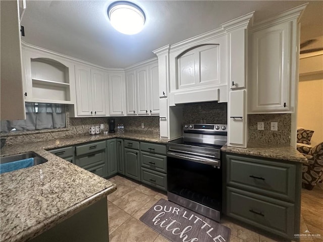 kitchen with sink, stone countertops, stainless steel electric range, white cabinetry, and light tile patterned flooring