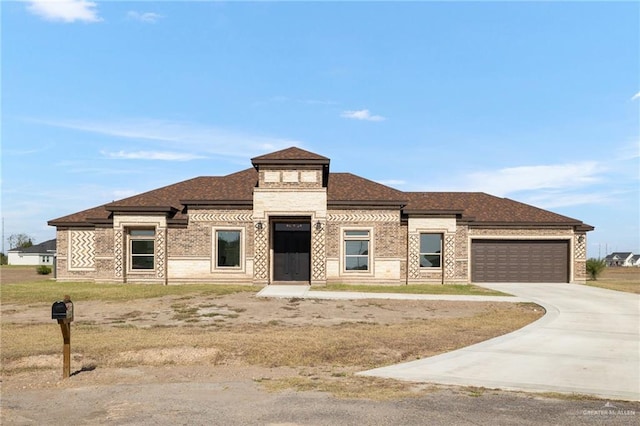 prairie-style house with a garage