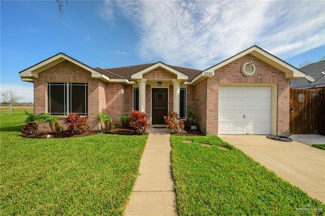 single story home with a garage and a front yard