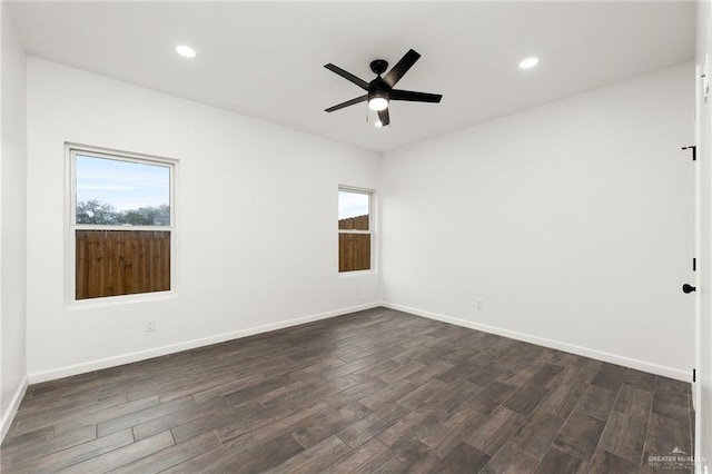 unfurnished room featuring dark hardwood / wood-style flooring and ceiling fan