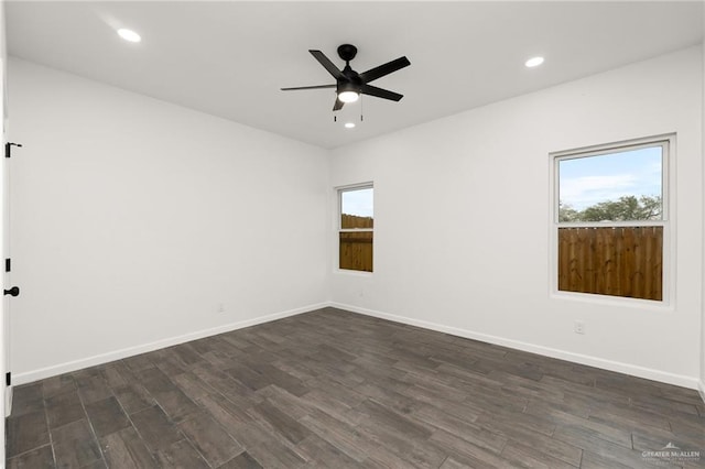 empty room featuring dark hardwood / wood-style floors and ceiling fan