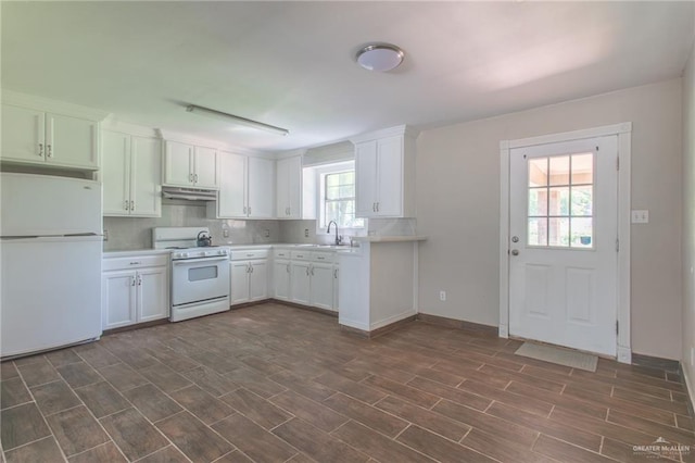 kitchen with white cabinets, white appliances, and a healthy amount of sunlight