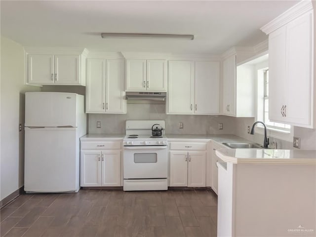 kitchen featuring white cabinetry, sink, white appliances, and dark wood-type flooring