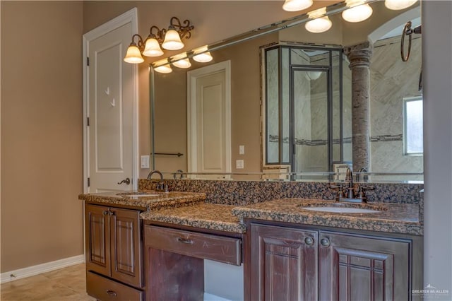 bathroom with tile patterned flooring and vanity