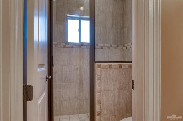 bathroom with a shower with shower door