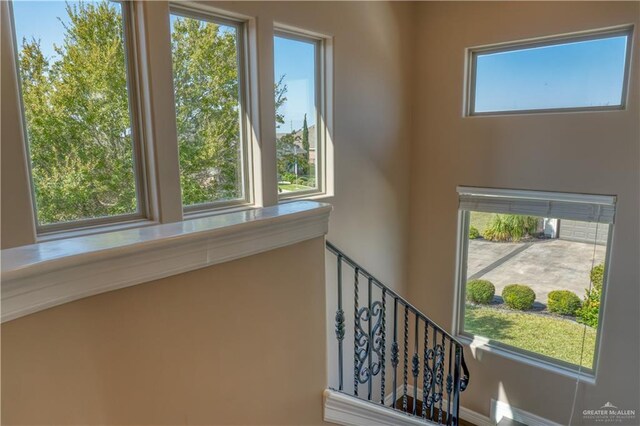 staircase with a wealth of natural light