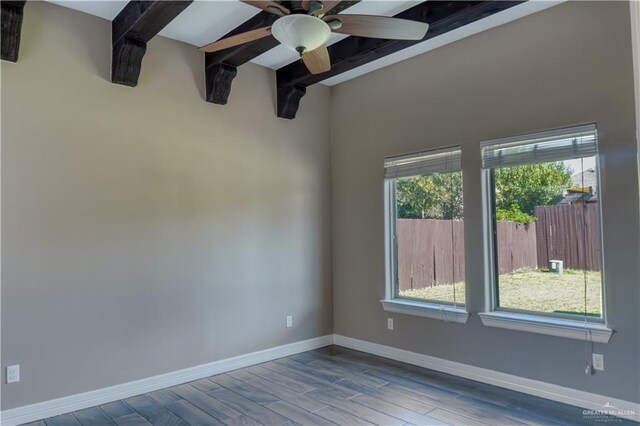 spare room with beam ceiling, ceiling fan, and light hardwood / wood-style floors