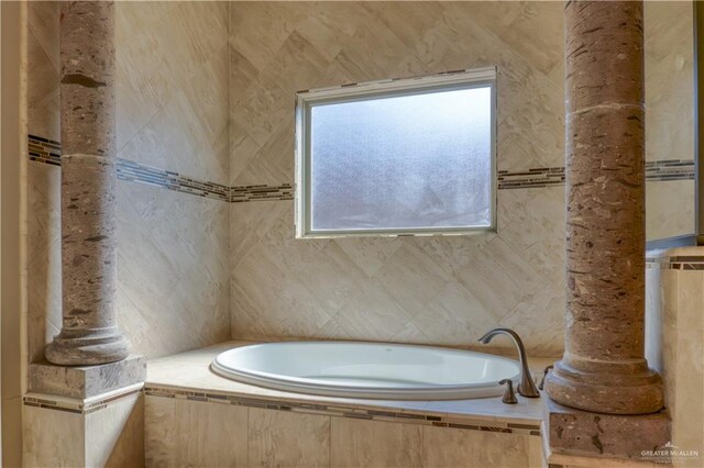 bathroom with tiled tub