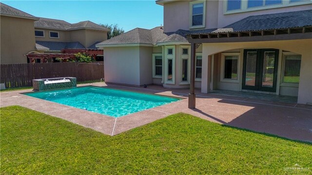 view of pool featuring a patio area and a yard