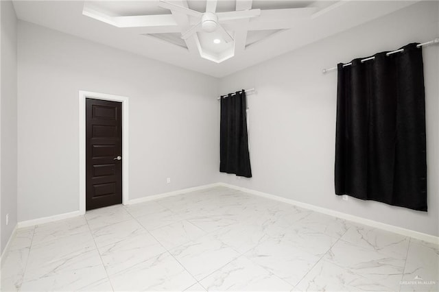 spare room featuring ceiling fan and coffered ceiling