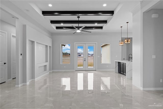 unfurnished living room featuring beam ceiling, french doors, and ceiling fan