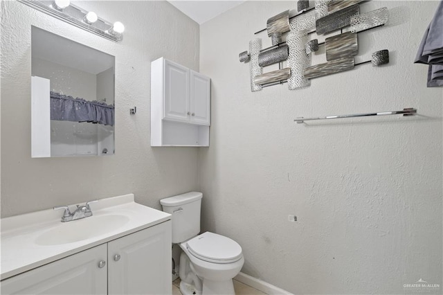 bathroom with toilet, curtained shower, and vanity