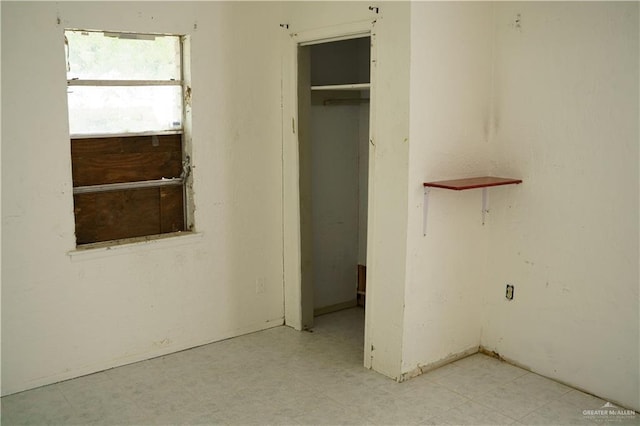 5909 S Kountry Loop, Mission, TX 78574 - unfurnished bedroom featuring a closet and tile patterned floors