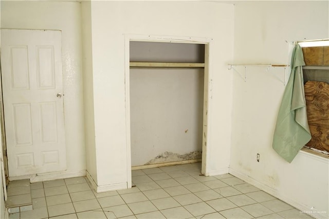 5909 S Kountry Loop, Mission, TX 78574 - unfurnished bedroom with light tile patterned floors and a closet