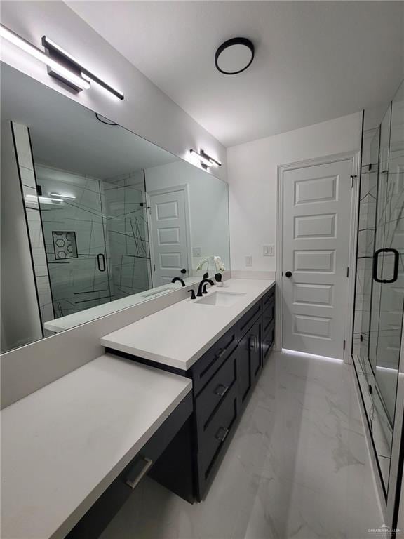 bathroom featuring vanity and an enclosed shower