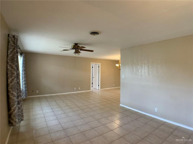 1802 N 17th St, Harlingen, TX 78550 - empty room with a chandelier and a ceiling fan