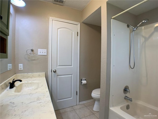 1802 N 17th St, Harlingen, TX 78550 - full bathroom with tile patterned floors, vanity, shower / washtub combination, and a textured wall