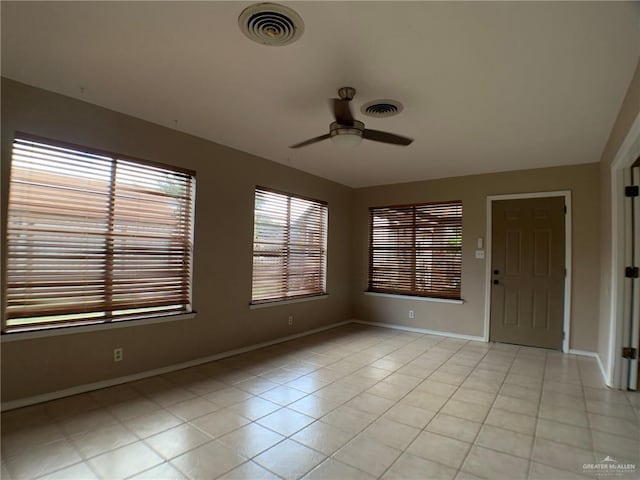 1802 N 17th St, Harlingen, TX 78550 - spare room with a ceiling fan and light tile patterned flooring