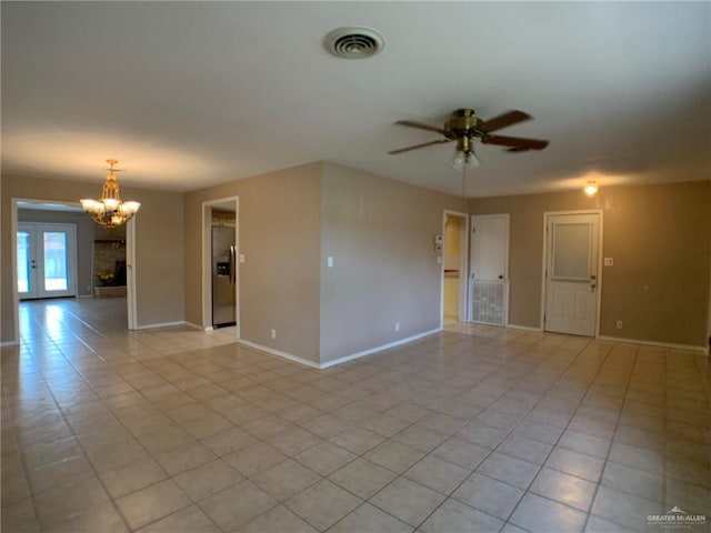 1802 N 17th St, Harlingen, TX 78550 - unfurnished room with ceiling fan, a chandelier, and light tile patterned flooring
