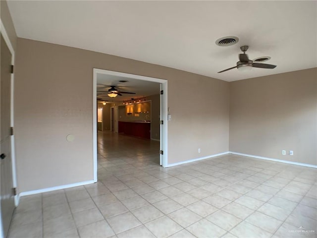 1802 N 17th St, Harlingen, TX 78550 - empty room featuring a ceiling fan and light tile patterned flooring