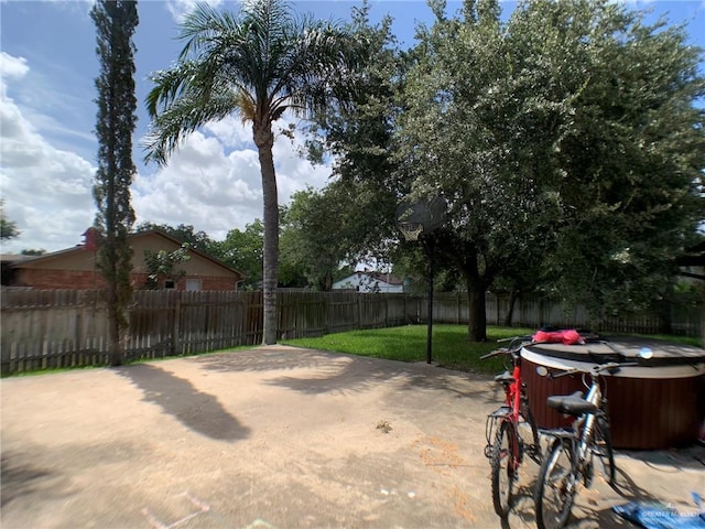 1802 N 17th St, Harlingen, TX 78550 - fenced backyard featuring a hot tub and a patio