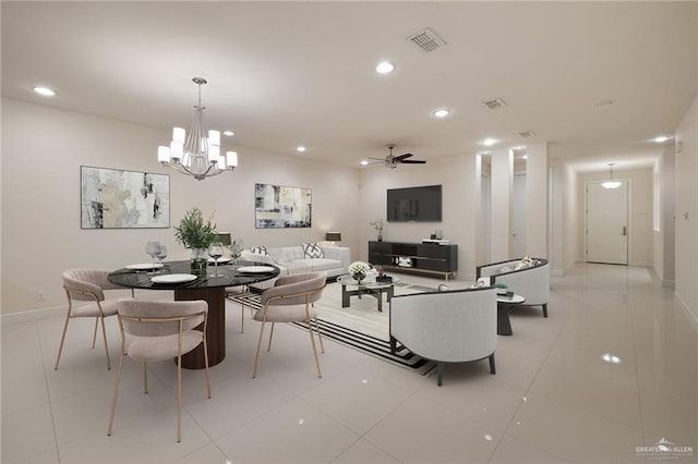 dining area with ceiling fan with notable chandelier and light tile patterned floors