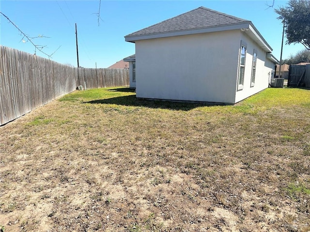 view of yard featuring cooling unit and a fenced backyard