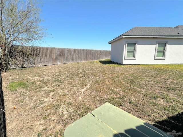 view of yard featuring a fenced backyard