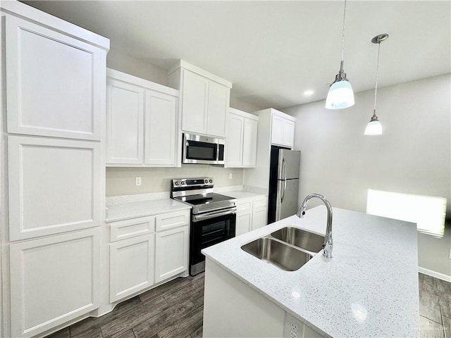 kitchen featuring dark hardwood / wood-style floors, sink, white cabinetry, and stainless steel appliances