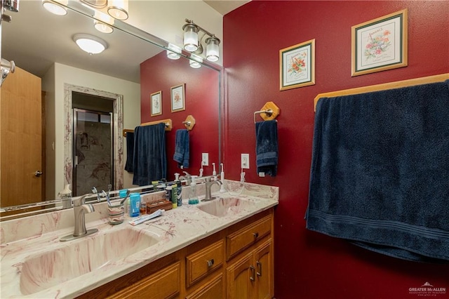 full bathroom with double vanity and a sink