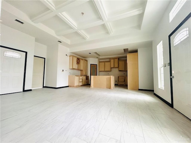 unfurnished living room featuring a towering ceiling, coffered ceiling, visible vents, beamed ceiling, and baseboards