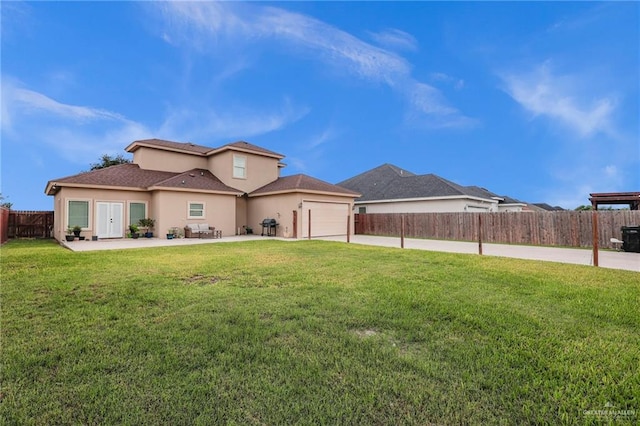 3120 La Puerta Ave, Edinburg, TX 78541 - rear view of property with stucco siding, a fenced backyard, an attached garage, concrete driveway, and roof with shingles