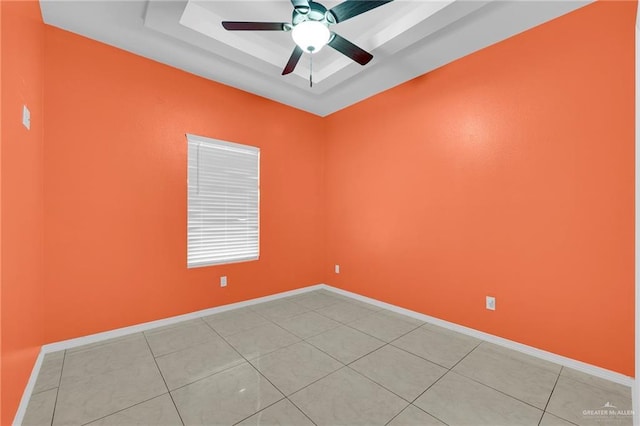 3120 La Puerta Ave, Edinburg, TX 78541 - empty room featuring a raised ceiling, light tile patterned flooring, and ceiling fan