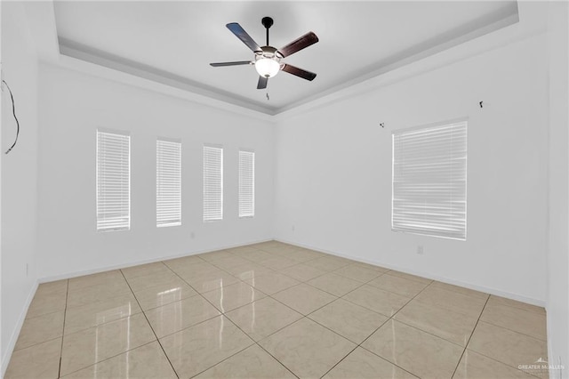 3120 La Puerta Ave, Edinburg, TX 78541 - spare room with a raised ceiling, a ceiling fan, and light tile patterned floors