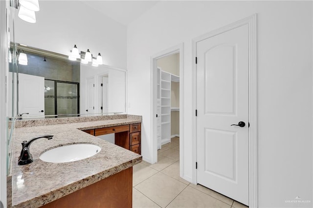 3120 La Puerta Ave, Edinburg, TX 78541 - full bathroom with a stall shower, vanity, tile patterned flooring, and a spacious closet