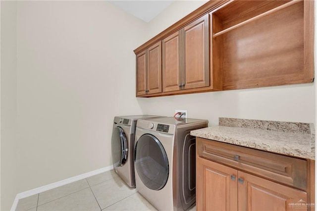 3120 La Puerta Ave, Edinburg, TX 78541 - laundry area featuring cabinet space, independent washer and dryer, and light tile patterned floors