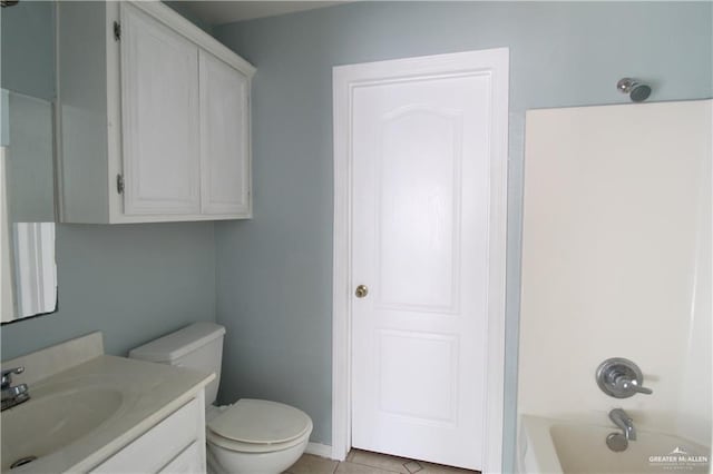 full bathroom with tile patterned floors, vanity, toilet, and shower / washtub combination