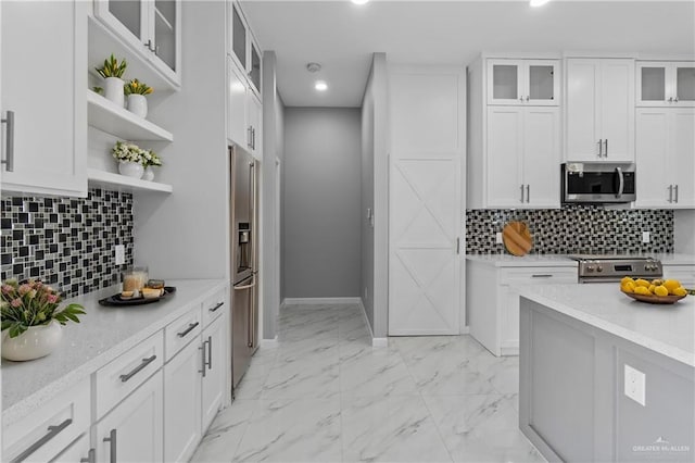 519 Oriole Dr, Los Fresnos, TX 78566 - kitchen with white cabinetry, open shelves, marble finish floor, and stainless steel appliances