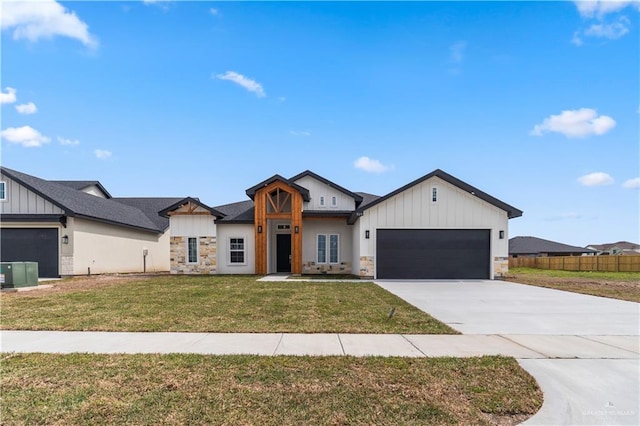 519 Oriole Dr, Los Fresnos, TX 78566 - modern farmhouse style home with a garage, stone siding, board and batten siding, and driveway